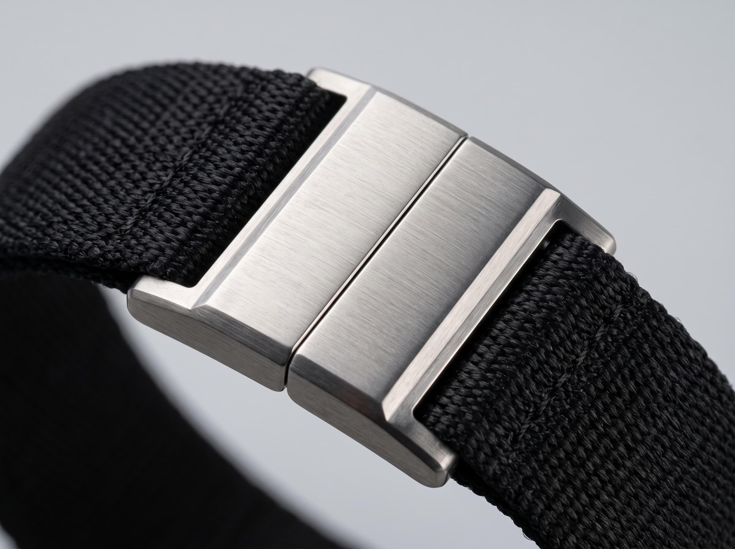 The two titanium halves of the MagLock clasp meeting in a fine seam